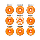 A headset top-cap in shiny anodised orange with multiple different written designs